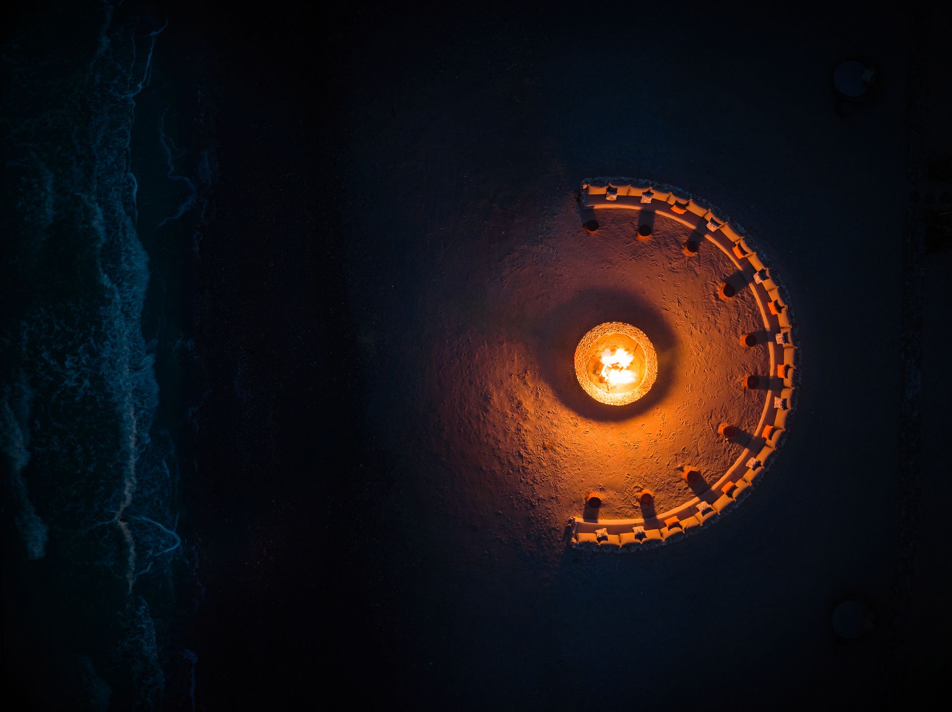 Aerial Photography Portfolio 5 Aerial night photography of oceanfront fire pit and seating area at Samanea Beach Resort & Spa Kep Cambodia, luxury resort drone photography