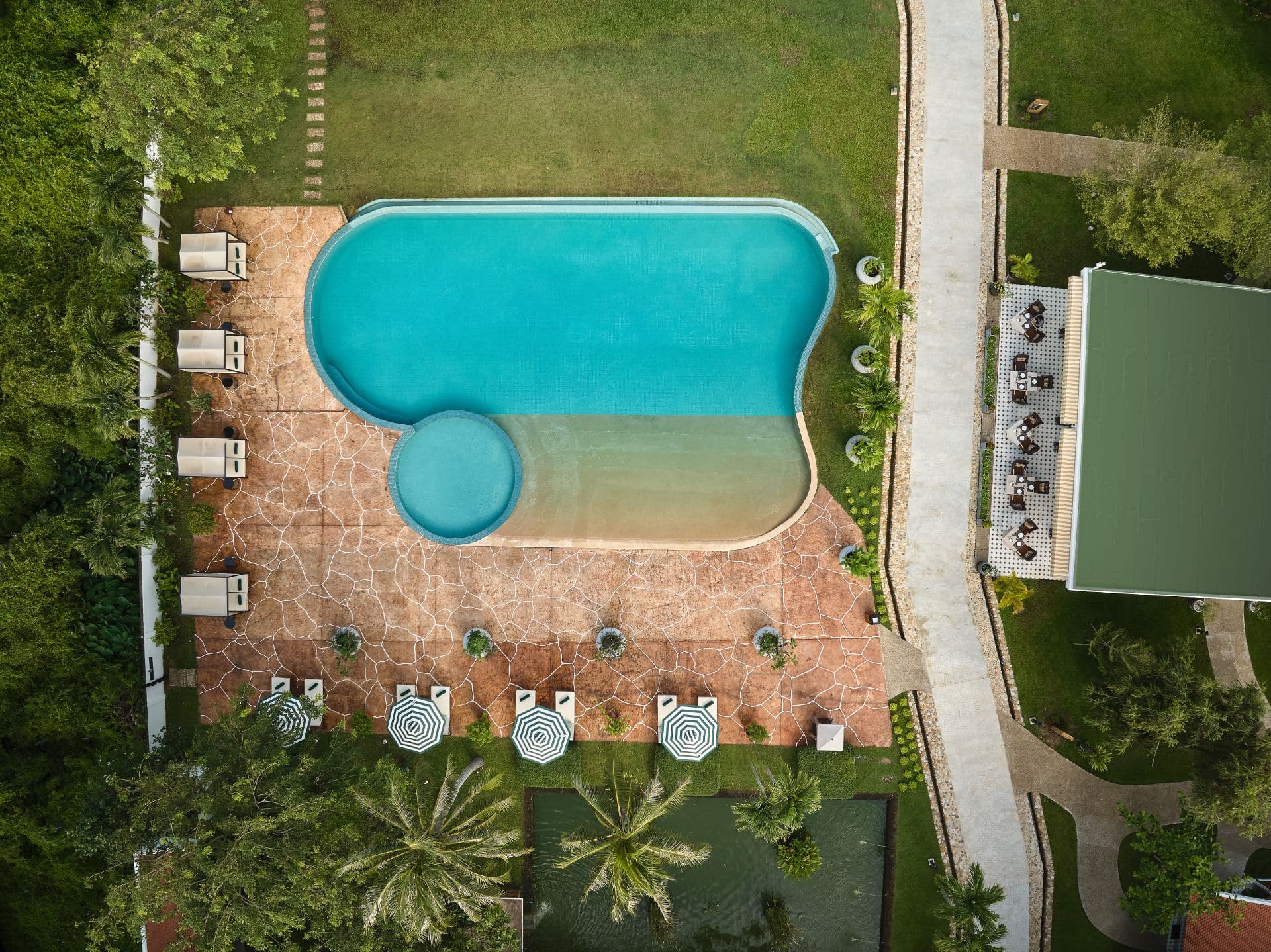 Aerial Photography Portfolio 2 Aerial drone photography of swimming pool and resort amenities at Samanea Beach Resort & Spa Kep Cambodia, luxury resort photography by bdv Photography